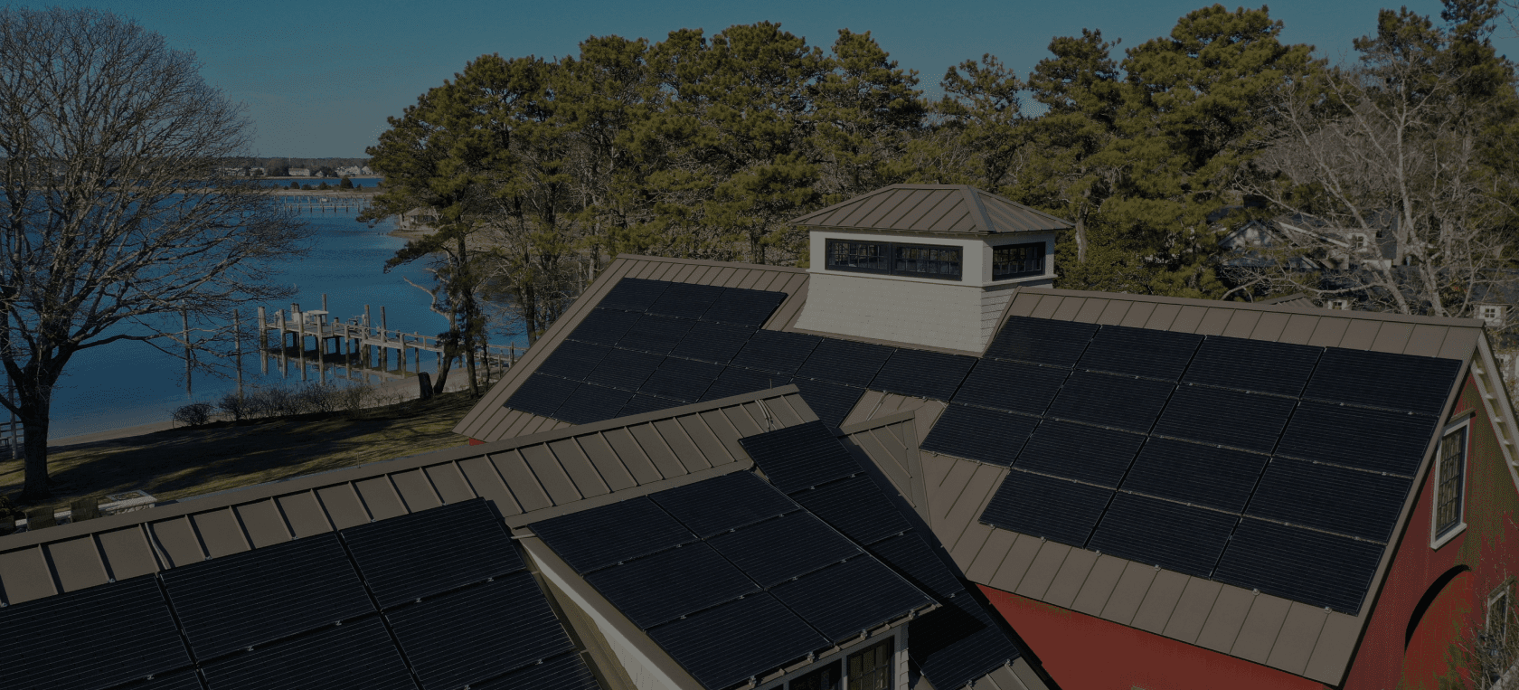 Solar Panels on Roofs of A Vermont Home Overlooking Champlain Lake