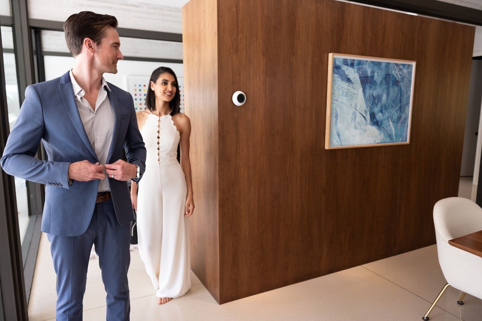 Young Couple in Suit & Dress Preparing to Leave House