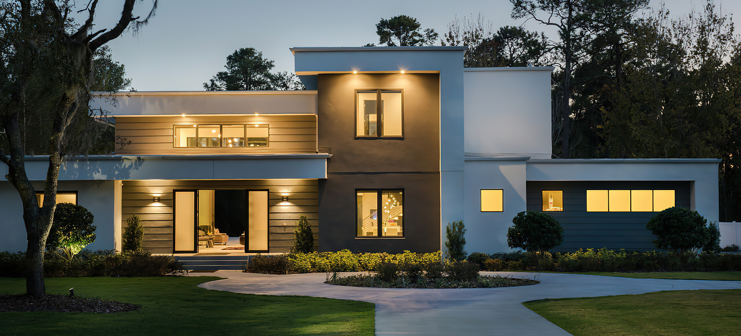 Exterior Evening View Two-Story Home Floor With Architectural Lighting