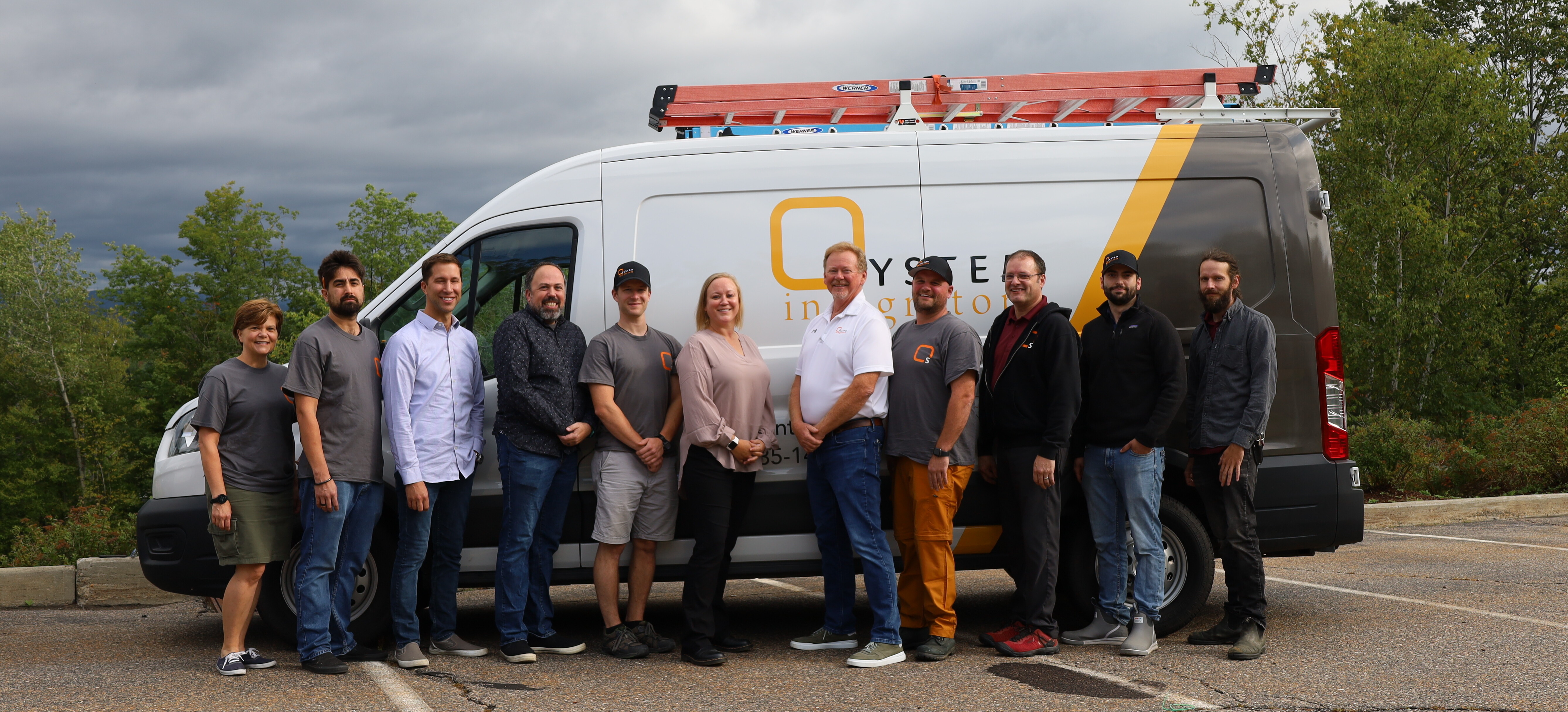 System Integrators Staff Outside in Front of a Company Van
