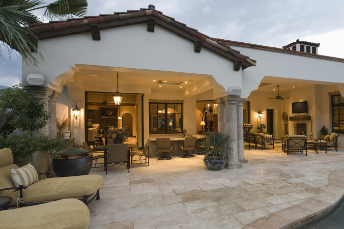 Furnished Outdoor Living Space with Stone Columns & Patio