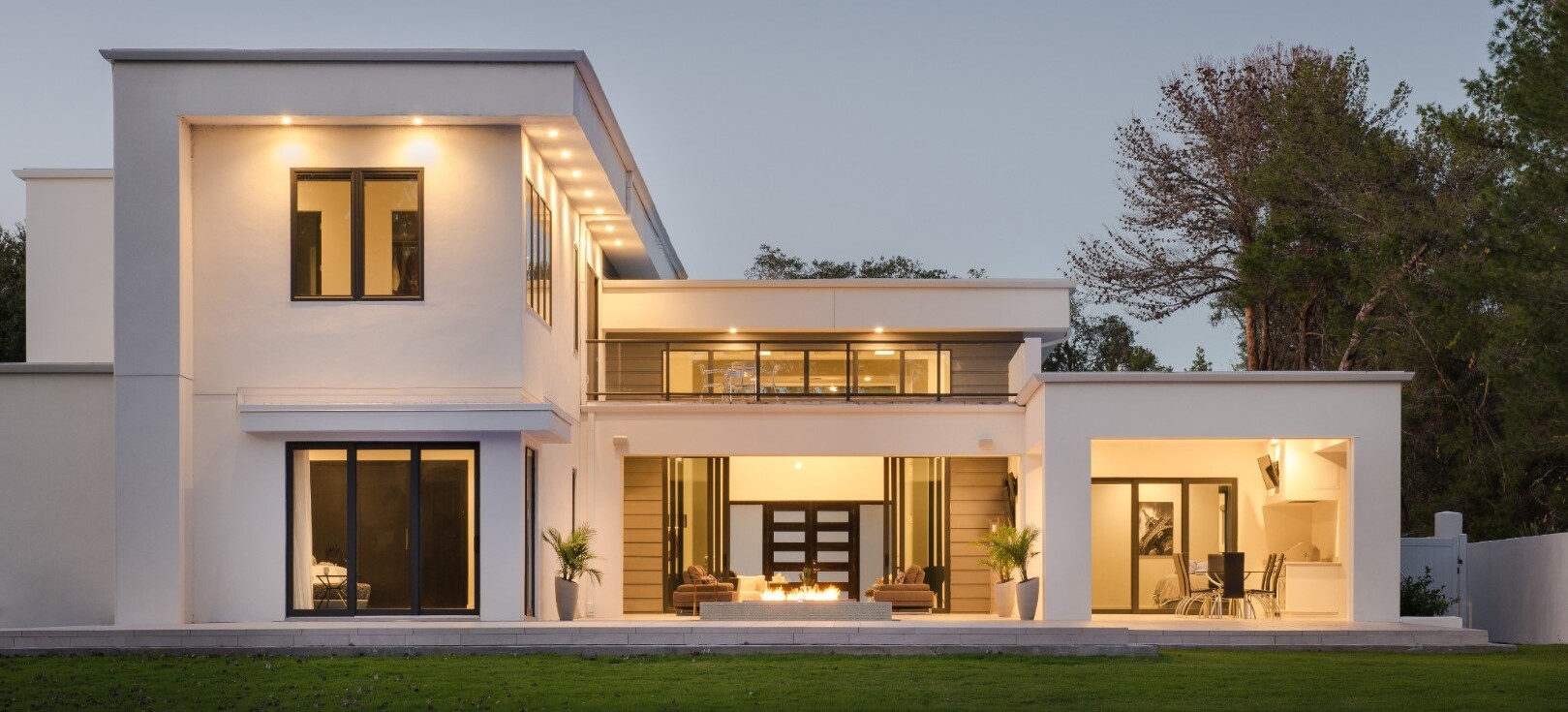 Exterior Evening View Two-Story Home Floor With Architectural Lighting